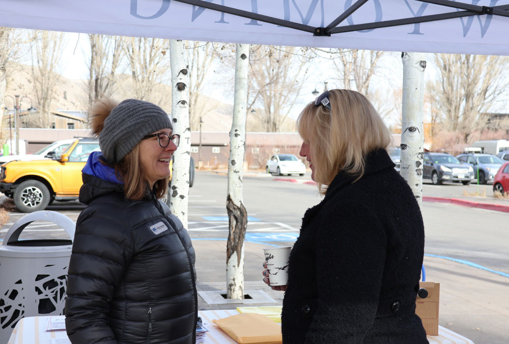 People talking at ceremony